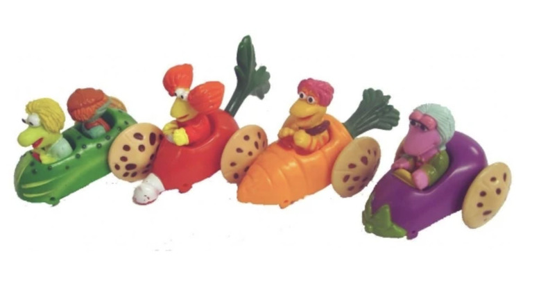 Close up of four Fraggle Rock Happy Meal cars and characters: boober, gobo, red, mokey and wembley