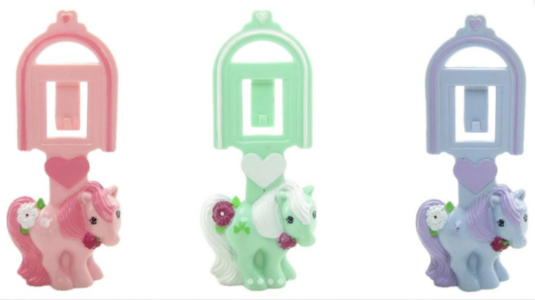 Three plastic book marks in pink, green and purple from the 1986 McDonalds My Little Pony Happy Meal