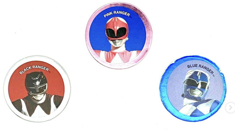 Three Power Ranger Pogs from the 1994 McDonalds Happy Meal -- Pink, Blue and Black Rangers