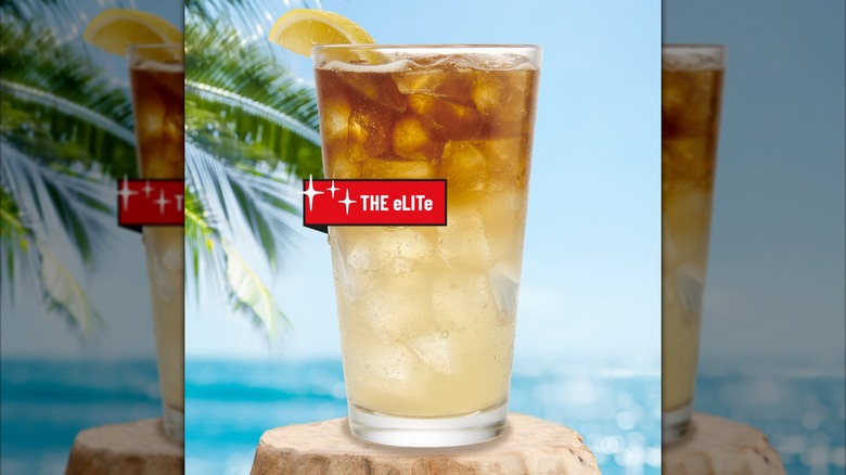 TGI Friday's the eLITe cocktail with a red label over the drink and a beach scene in the background, with mirror borders