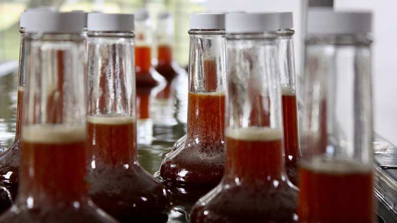 The tops of a few bottles of cane syrup