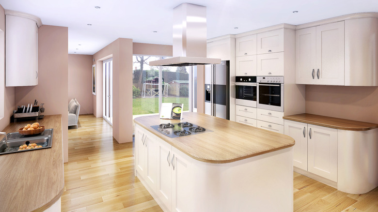 Bright kitchen with curved island and countertops