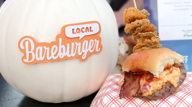 Burger on a tray with the Bareburger logo on a white pumpkin