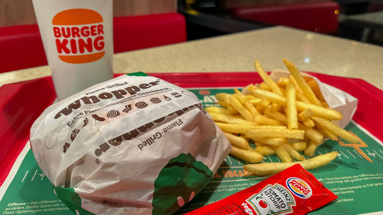 Burger King Whopper, fries, and a drink on a tray