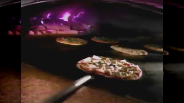 Pizzas in the wood oven at Bertucci's commercial still