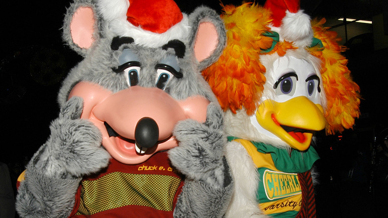 Chuck E. Cheese mascot with bird mascot