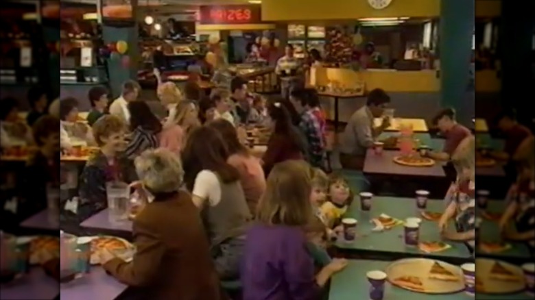 Interior of Peter Piper Pizza with tables full of customers