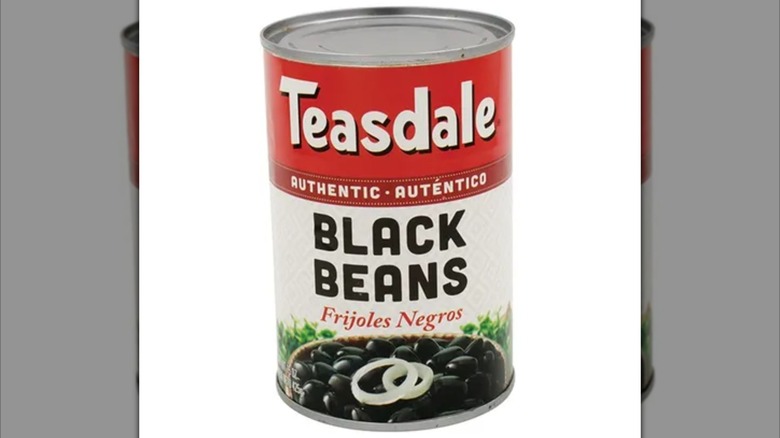 Can of Teasdale beans against white background, mirrored image