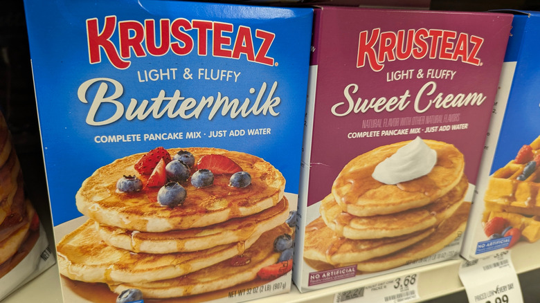 Boxes of Krusteaz pancake mix on the grocery store shelf