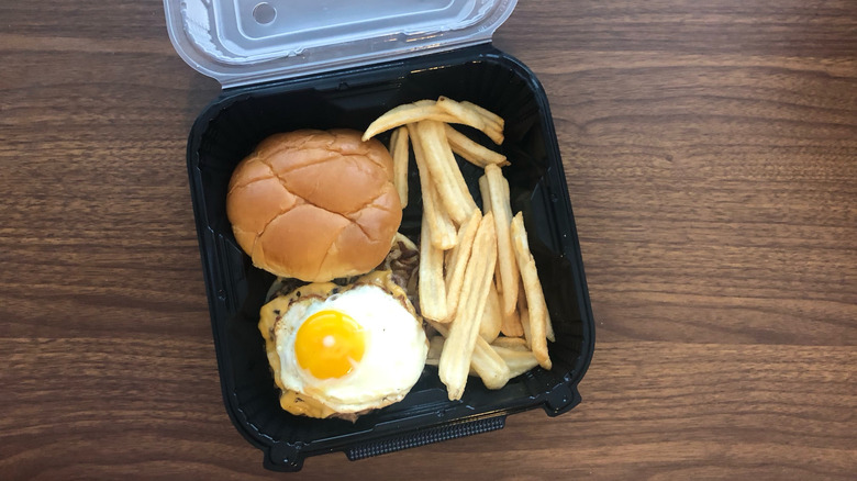 Denny's Slamburger meal in a to-go box.