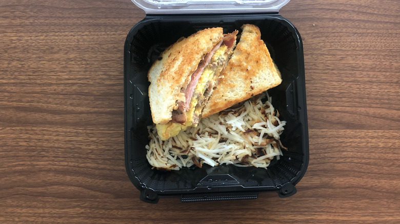 Denny's The Grand Slamwich meal in to-go box.