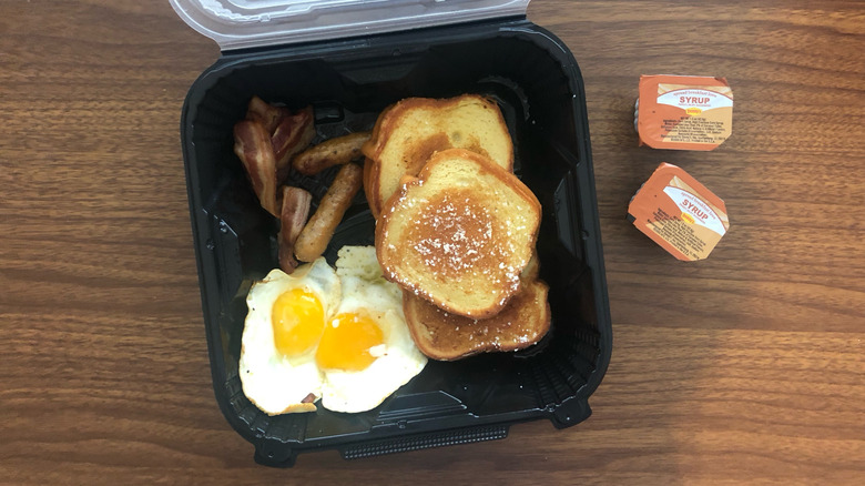 Denny's French Toast Slam in a to-go box.