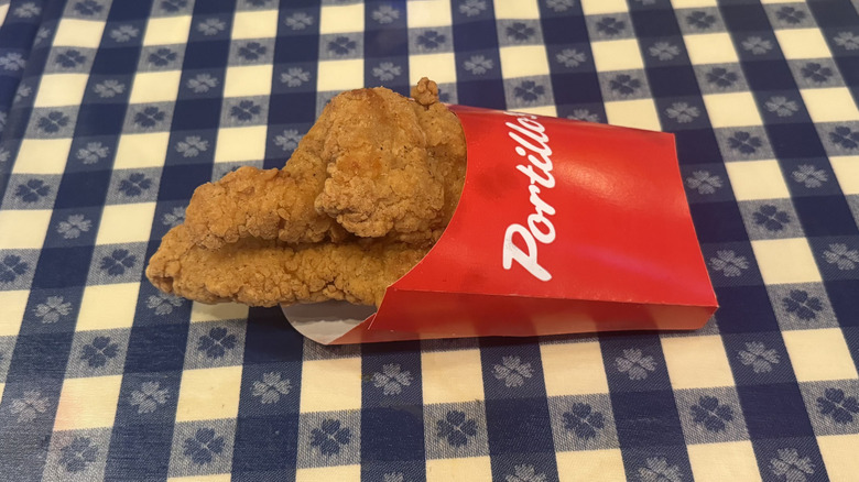 Portillo's chicken tenders in red to-go container.
