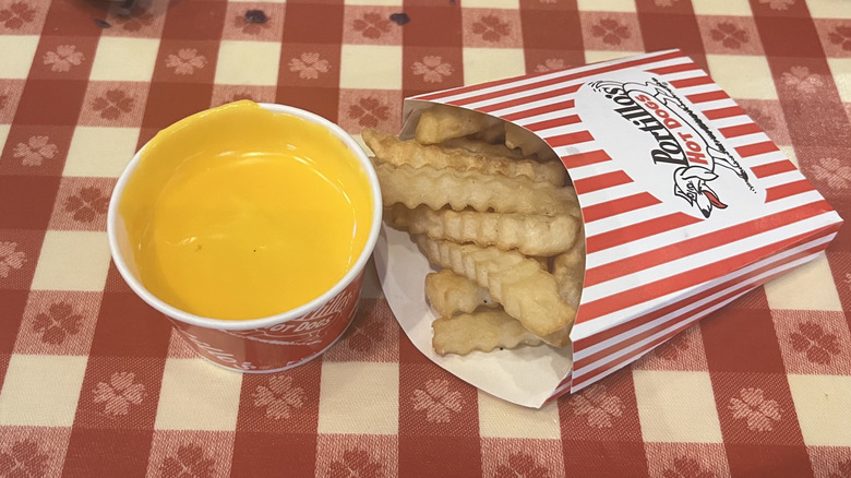 Portillo's crinkle-cut fries with cup of cheese sauce.