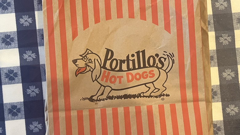Portillo's to-go back on checkered tablecloth.