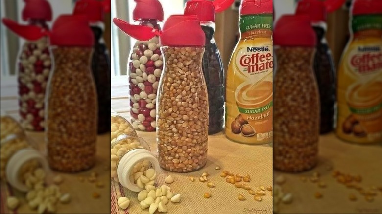 Nestle Coffee Mate creamer containers holding popcorn and candy