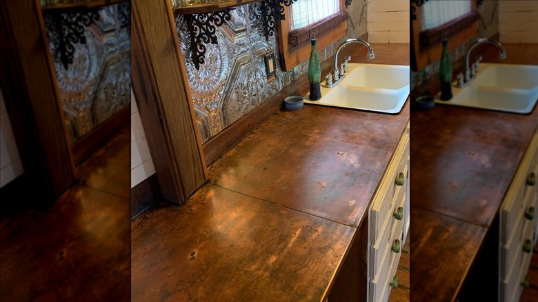 Copper countertop next to white sink
