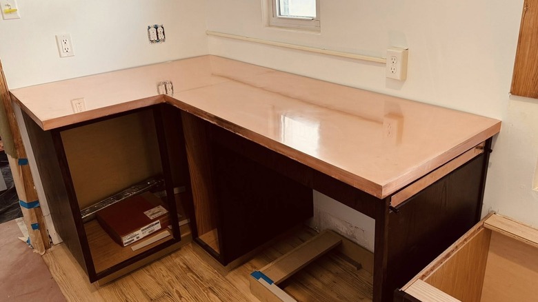Copper countertop in unfinished kitchen