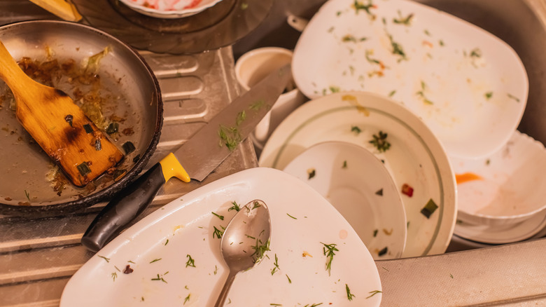 Top view of dirty dishes in a kitchen sink