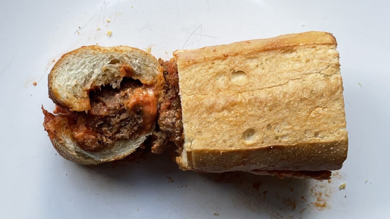 Cross section slice of the meatball sub on a plate
