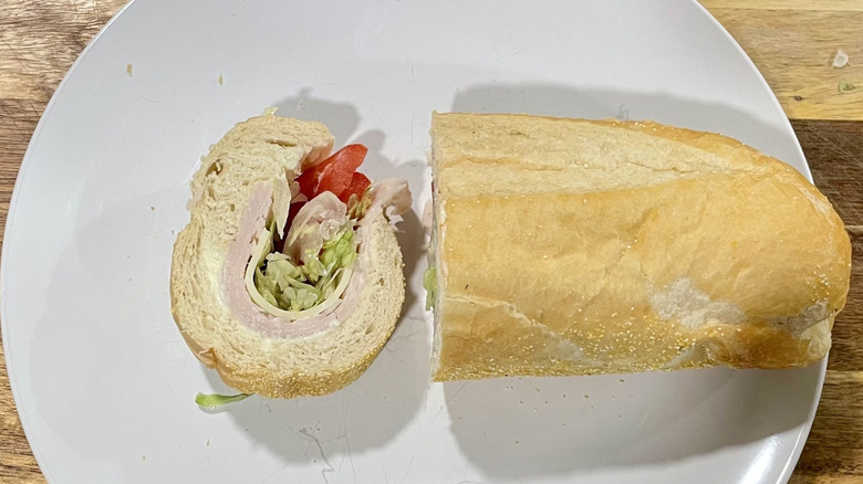 Cross section slice of a turkey sub sandwich on a plate