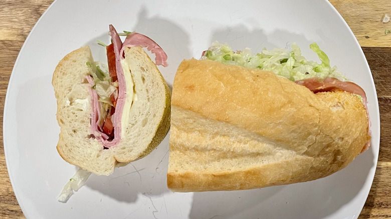 Cross section cut of a ham sub sandwich on a plate