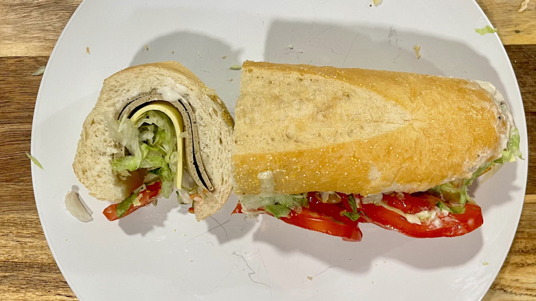 Cross section cut of the Vegetarian Turkey Club sandwich on a plate