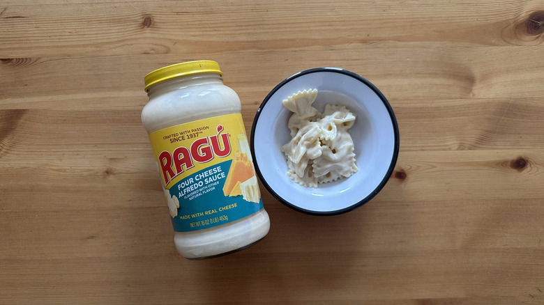 Four Cheese Alfredo Sauce with pasta in white bowl