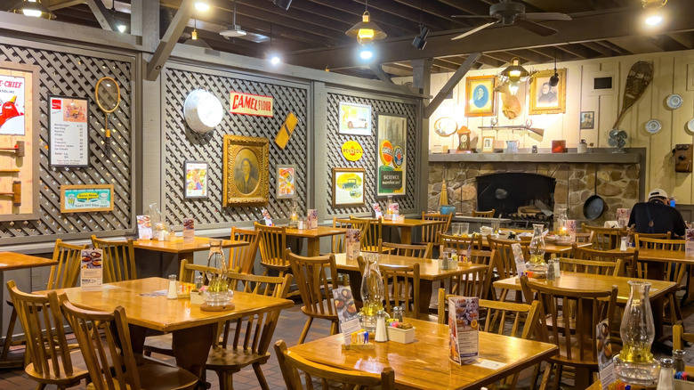 An empty Cracker Barrel restaurant with tables and chairs