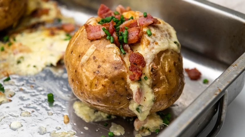 Loaded baked potato in baking pan