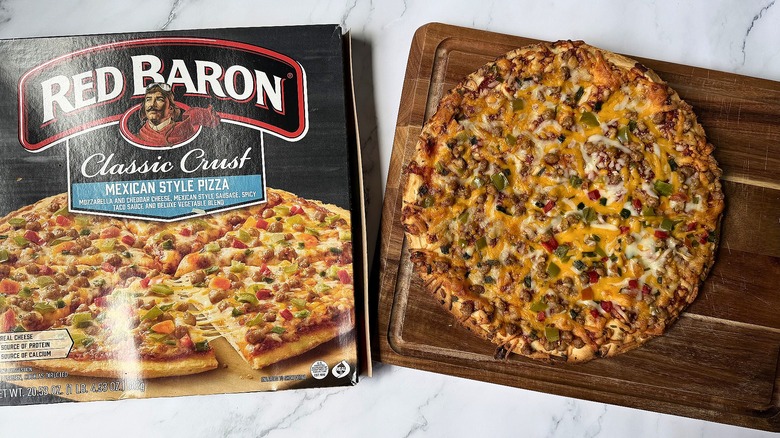 Red Baron Classic Crust Mexican Style pizza box next to pizza on cutting board