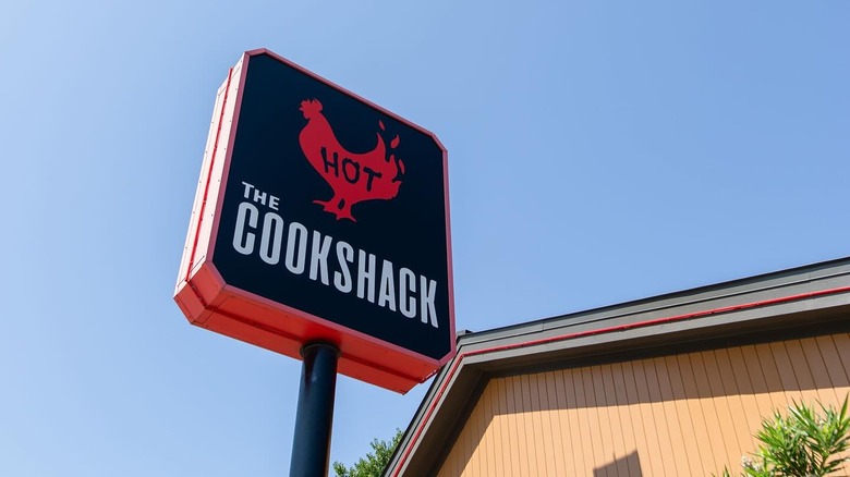 The Cookshack sign on blue sky background
