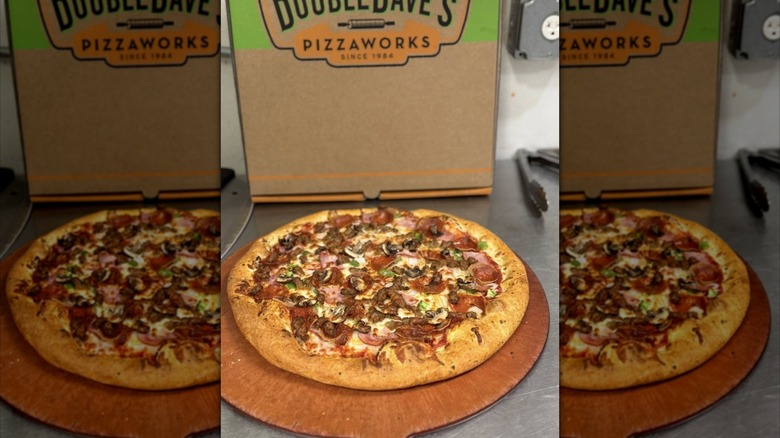 Mirrored image of pizza in front of DoubleDave's Pizzaworks pizza box
