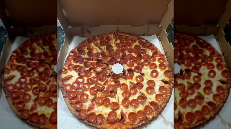 Mirrored image of Gionino's pepperoni pizza in a box