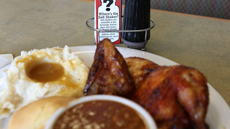 Boston Market mashed potatoes on plate with other food