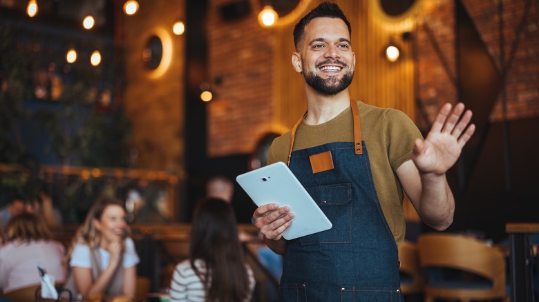A server greeting at a restaurant