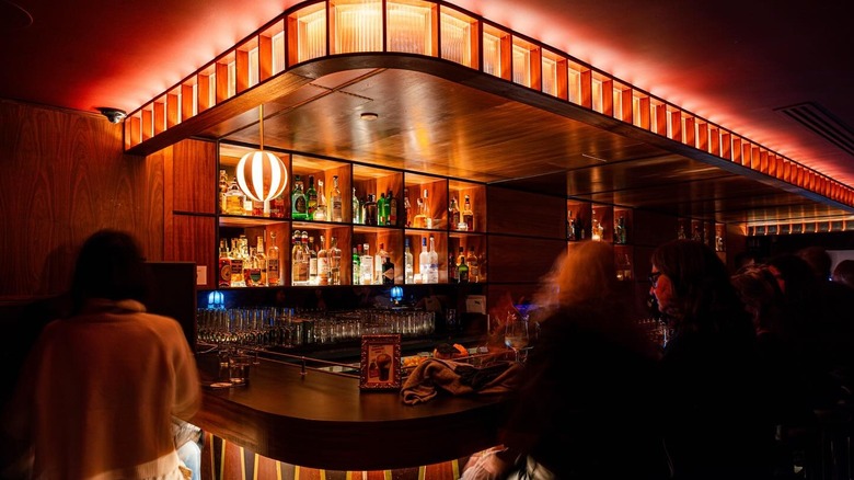 Patrons sit around the bar at Agency of Record in New York