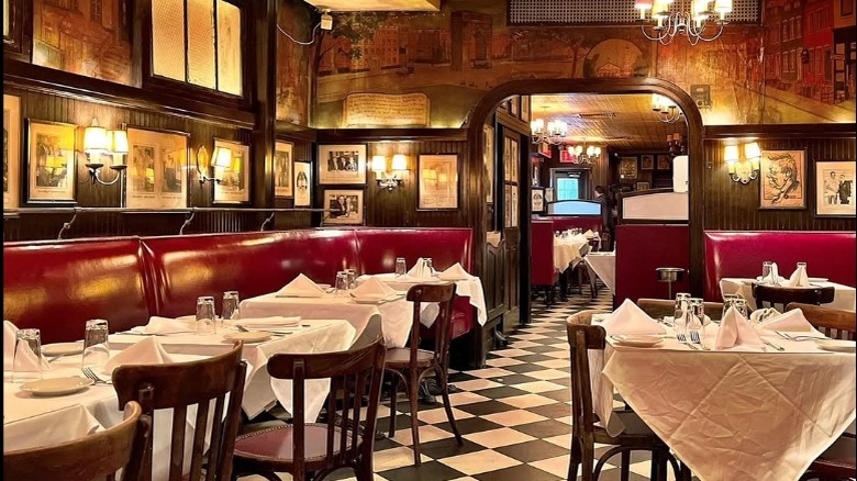 A sign dominates the main street entrance for Minetta Tavern Restaurant in New York