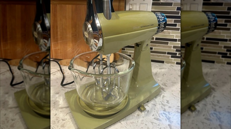 Mirrored image of green Sunbean Mixmaster on kitchen countertop