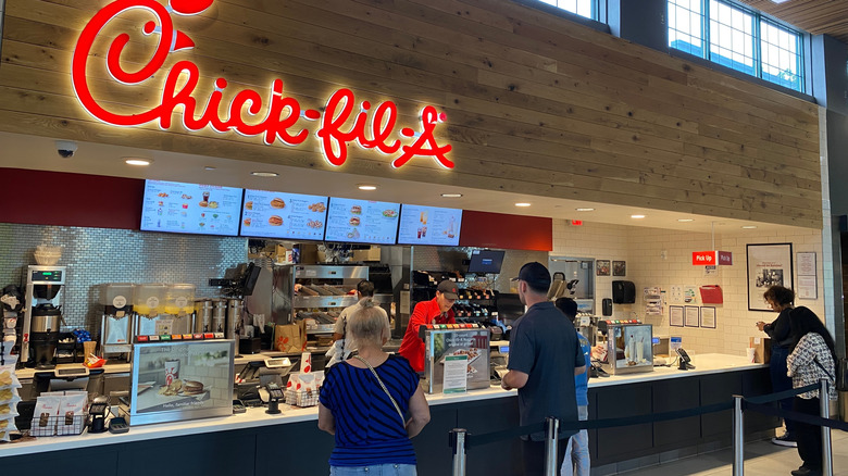 Customers wait in line at a Chick-fil-a