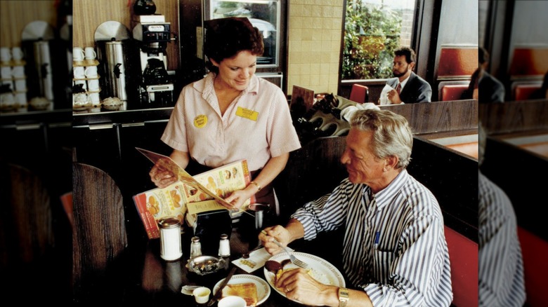 Server interacting with a customer at Waffle House