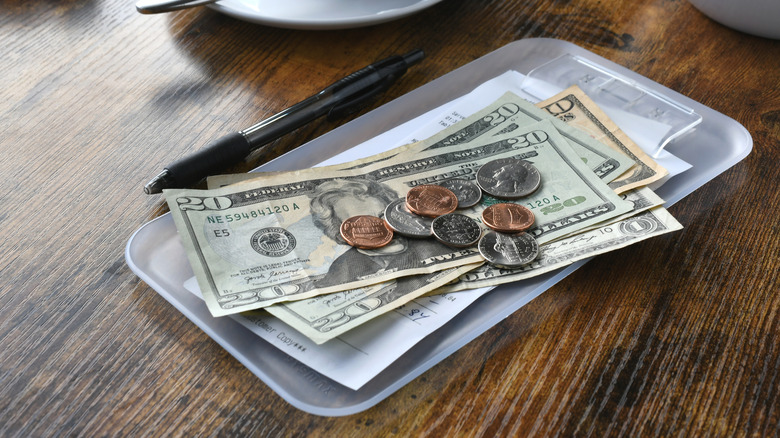 Cash tip on a restaurant table