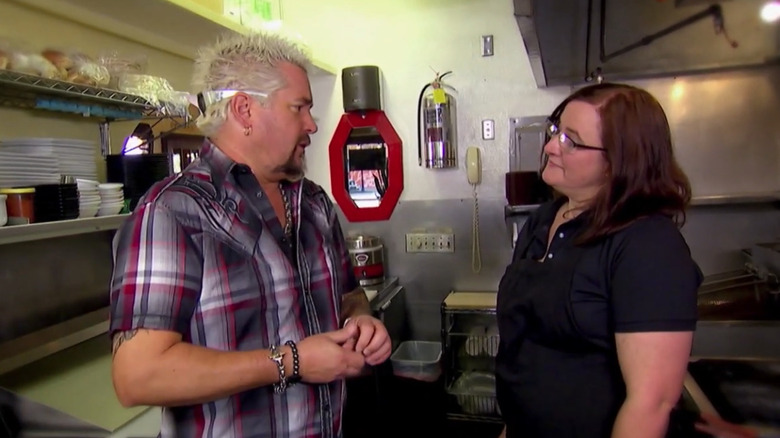 Guy Fieri with Lorrena Filgas in the kitchen at Cafe Nooner
