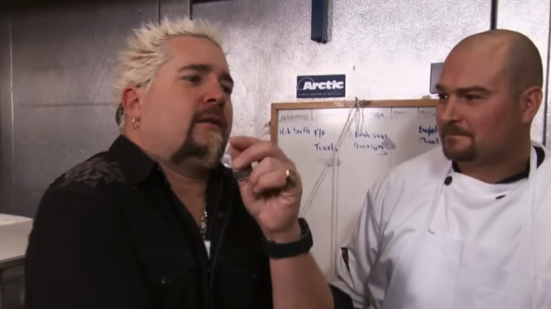 Guy Fieri with chef in the kitchen