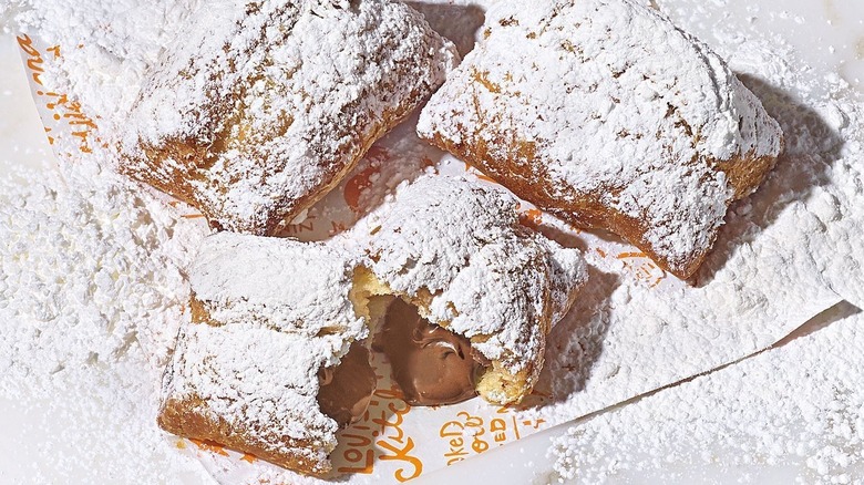 Popeye's chocolate beignets in branded parchment paper
