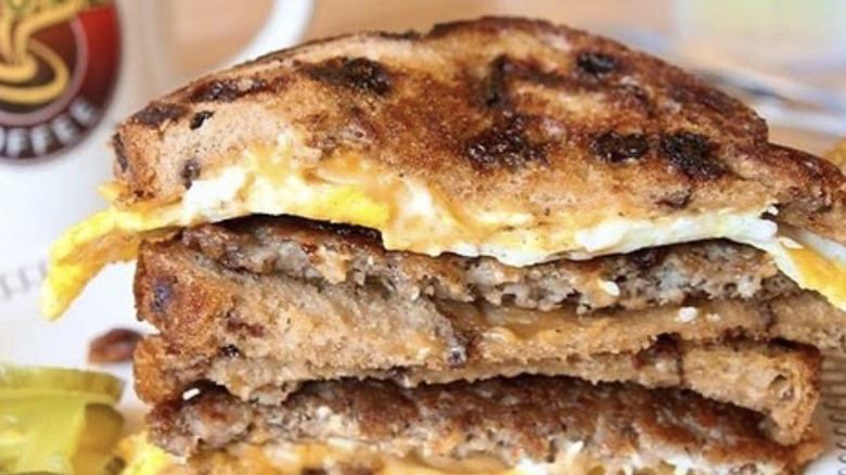 A Waffle House sausage, egg, and cheese on raisin toast