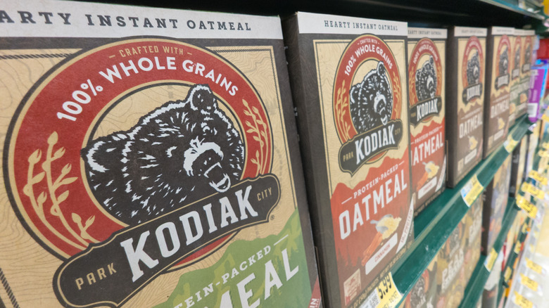 Several boxes of Kodiak Cakes on a shelf at Walmart