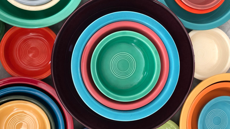 Stacks of vintage Fiestaware in multiple colors