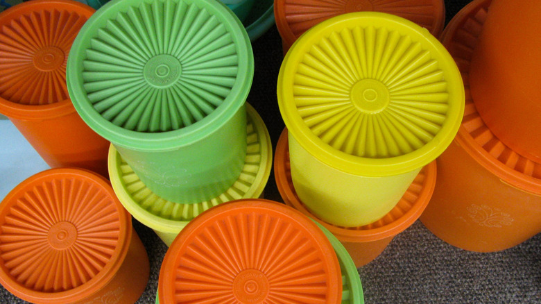 Vintage Tupperware canisters in various colors