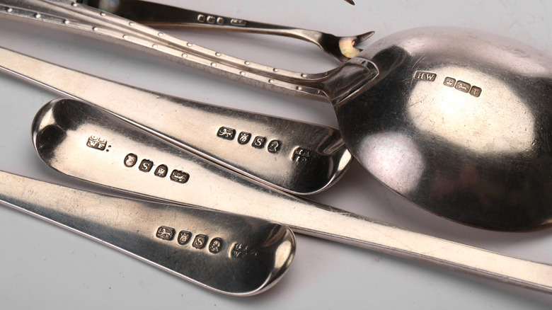 Various silver spoons with hallmarks